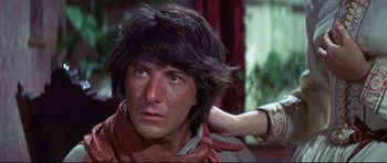 Movie still from “Little Big Man” (1970), directed by Arthur Penn – A person with long black hair; Close Up shot, Low angle