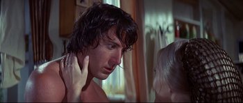 Movie still from “Little Big Man” (1970), directed by Arthur Penn – A person with wet hair looking at another person; Close Up shot, Over the shoulder angle