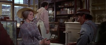 Movie still from “Little Big Man” (1970), directed by Arthur Penn – A woman sitting at a table in front of a man in an apron; Medium shot, Over the shoulder angle
