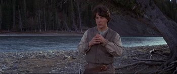 Movie still from “Little Big Man” (1970), directed by Arthur Penn – A man standing in front of a body of water; Medium shot, Low angle