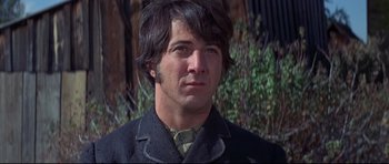 Movie still from “Little Big Man” (1970), directed by Arthur Penn – A person wearing a suit and tie; Close Up shot, Low angle