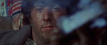 Movie still from “Little Big Man” (1970), directed by Arthur Penn – A man's face in front of a mirror; Close Up shot, Low angle