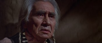 Movie still from “Little Big Man” (1970), directed by Arthur Penn – An old man with a long gray hair and a beard; Close Up shot, Low angle