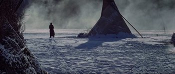 Movie still from “Little Big Man” (1970), directed by Arthur Penn – A person standing in the snow next to a tent; Extreme Wide shot, High angle