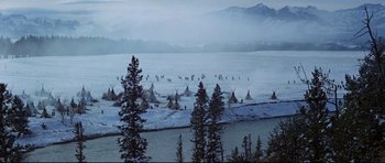 Movie still from “Little Big Man” (1970), directed by Arthur Penn – Many teepees in the snow near the water; Extreme Wide shot, High angle