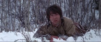 Movie still from “Little Big Man” (1970), directed by Arthur Penn – A man laying in the snow in a field; Medium shot, Overhead angle