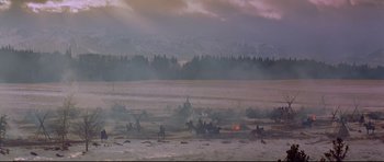 Movie still from “Little Big Man” (1970), directed by Arthur Penn – A group of people riding horses in a field; Extreme Wide shot, High angle