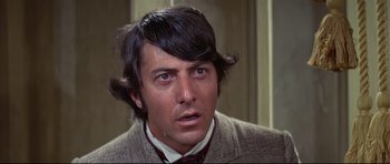 Movie still from “Little Big Man” (1970), directed by Arthur Penn – A person wearing a suit and tie; Close Up shot, Over the shoulder angle