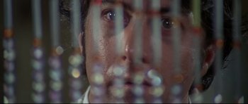 Movie still from “Little Big Man” (1970), directed by Arthur Penn – A man's face behind bars; Extreme Close Up shot, Low angle