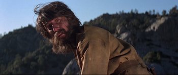 Movie still from “Little Big Man” (1970), directed by Arthur Penn – A man with long hair and a long beard; Close Up shot, Low angle