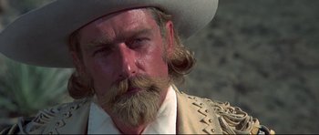 Movie still from “Little Big Man” (1970), directed by Arthur Penn – A person wearing a cowboy hat; Close Up shot, Low angle