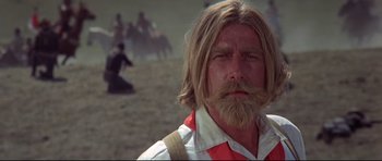 Movie still from “Little Big Man” (1970), directed by Arthur Penn – A person with long hair and a beard; Close Up shot, Low angle
