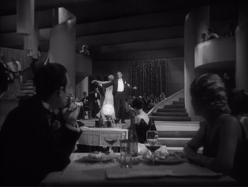 Movie still from “Little Caesar” (1931), directed by Mervyn LeRoy – A man and a woman dancing in a restaurant; Extreme Wide shot, High angle