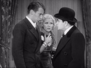 Movie still from “Little Caesar” (1931), directed by Mervyn LeRoy – Two men and a woman standing next to each other; Medium shot, Low angle