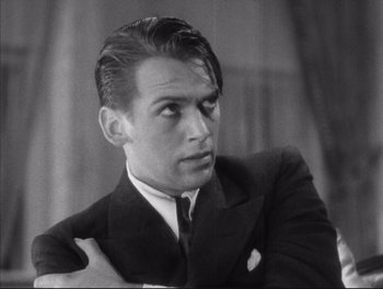 Movie still from “Little Caesar” (1931), directed by Mervyn LeRoy – Black and white photograph of a man wearing a suit; Close Up shot, High angle