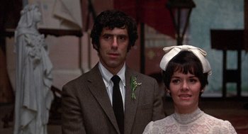 Movie still from “Little Murders” (1971), directed by Alan Arkin – A man and a woman standing next to each other; Close Up shot, Low angle