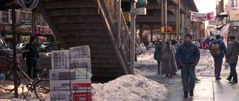Movie still from “Little Odessa” (1994), directed by James Gray – People walking down a sidewalk in the snow; Wide shot, High angle