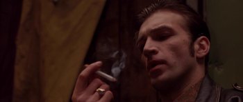 Movie still from “Little Odessa” (1994), directed by James Gray – A person smoking a cigarette; Close Up shot, Low angle