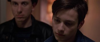 Movie still from “Little Odessa” (1994), directed by James Gray – A young man sitting next to another young man; Close Up shot, Over the shoulder angle