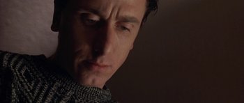 Movie still from “Little Odessa” (1994), directed by James Gray – A person wearing a sweater; Close Up shot, Low angle