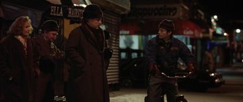 Movie still from “Little Odessa” (1994), directed by James Gray – Two people standing on a street at night talking; Medium shot, Over the shoulder angle