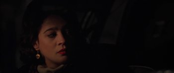 Movie still from “Little Odessa” (1994), directed by James Gray – A woman sitting in a car in the dark; Close Up shot, High angle