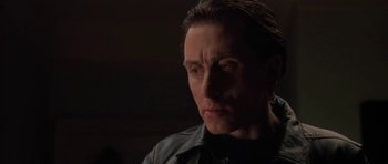 Movie still from “Little Odessa” (1994), directed by James Gray – A person wearing a black shirt; Close Up shot, Low angle