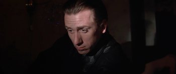 Movie still from “Little Odessa” (1994), directed by James Gray – A person wearing a leather jacket; Close Up shot, Low angle