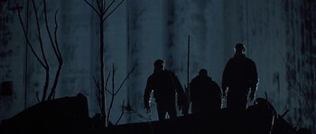 Movie still from “Little Odessa” (1994), directed by James Gray – A group of people standing on top of a hill at night; Wide shot, Low angle