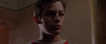 Movie still from “Little Odessa” (1994), directed by James Gray – A young man is looking into the distance; Close Up shot, Low angle