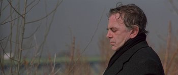 Movie still from “Little Odessa” (1994), directed by James Gray – A person wearing a jacket; Close Up shot, Low angle