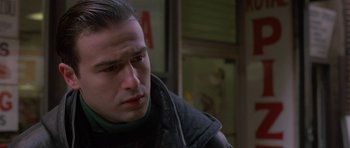 Movie still from “Little Odessa” (1994), directed by James Gray – A person wearing a black jacket; Close Up shot, Over the shoulder angle
