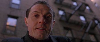 Movie still from “Little Odessa” (1994), directed by James Gray – A man's face as he stares into the camera; Close Up shot, Low angle