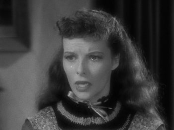 Movie still from “Little Women” (1933), directed by George Cukor – A black and white photo of a woman with long hair; Close Up shot, High angle