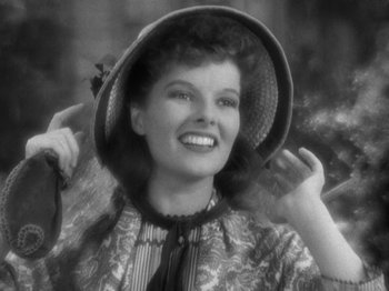 Movie still from “Little Women” (1933), directed by George Cukor – An old black and white photo of a woman wearing a hat; Close Up shot, Low angle