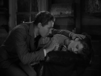 Movie still from “Little Women” (1933), directed by George Cukor – A man and a boy are playing a game; Medium shot, High angle