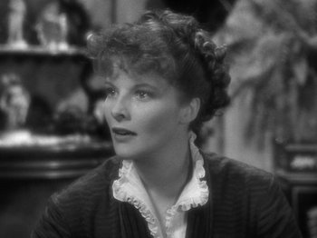 Movie still from “Little Women” (1933), directed by George Cukor – An old photo of an older woman in a black sweater; Close Up shot, High angle