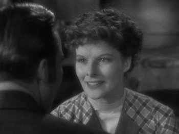 Movie still from “Little Women” (1933), directed by George Cukor – An old photo of a man and a woman talking to each other; Close Up shot, Over the shoulder angle