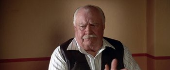 Movie still from “Lone Star” (1996), directed by John Sayles – An older man with a mustache and a mustache comb; Close Up shot, Low angle