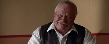 Movie still from “Lone Star” (1996), directed by John Sayles – An older man wearing a vest and a white shirt; Close Up shot, Low angle