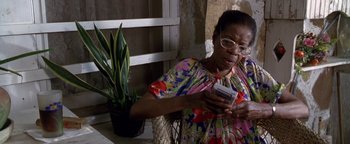 Movie still from “Lone Star” (1996), directed by John Sayles – An older woman holding a cell phone in her hands; Close Up shot, High angle