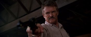 Movie still from “Lone Star” (1996), directed by John Sayles – A person holding a gun; Close Up shot, Low angle