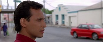 Movie still from “Lone Star” (1996), directed by John Sayles – A person in a red shirt near a building; Close Up shot, Low angle