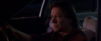 Movie still from “Lone Star” (1996), directed by John Sayles – A person sitting in a car; Close Up shot, Low angle