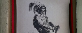 Movie still from “Lone Star” (1996), directed by John Sayles – An old drawing of a man with a feather headdress holding a sword; Extreme Close Up shot, Low angle