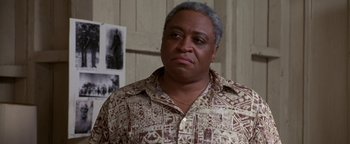 Movie still from “Lone Star” (1996), directed by John Sayles – A person wearing a hawaiian shirt; Close Up shot, Low angle