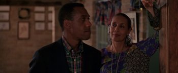 Movie still from “Lone Star” (1996), directed by John Sayles – A man and a woman standing next to each other in a room; Medium shot, Over the shoulder angle