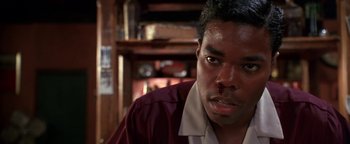 Movie still from “Lone Star” (1996), directed by John Sayles – A person wearing a maroon shirt; Close Up shot, Low angle