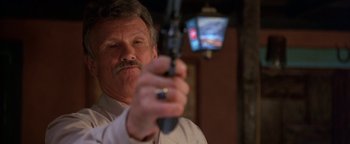Movie still from “Lone Star” (1996), directed by John Sayles – A person holding a gun in his hand; Close Up shot, Low angle