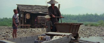Movie still from “Lone Wolf and Cub: Baby Cart to Hades” (1972), directed by Kenji Misumi – A man and a child in traditional japanese garb; Wide shot, High angle